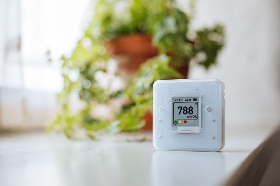 Indoor air quality monitor showing CO2 levels