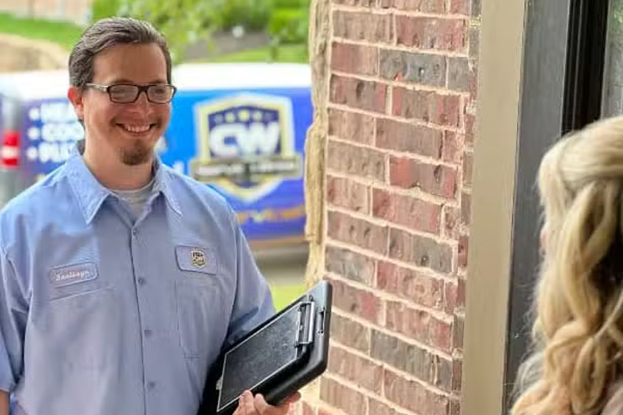 CW Service Pros technician meeting customer before inspection