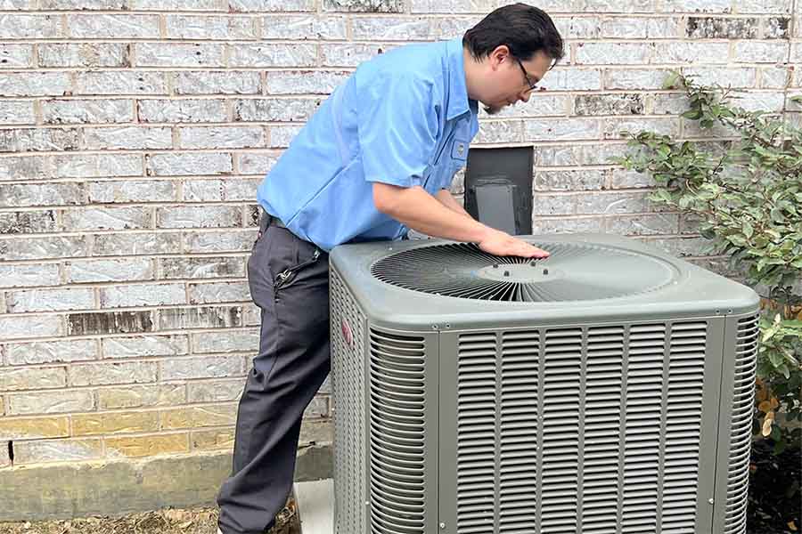AC maintenance performed by CW Service Pros technician