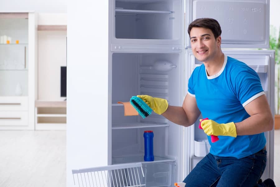 Cleaning out your fridge is a great start to preparing house for vacation