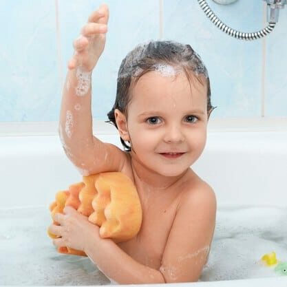 cheerful-positive-adorable-small-child-taking-bath-washing-herself-with-yellow-sponge_176532-7868.jpg