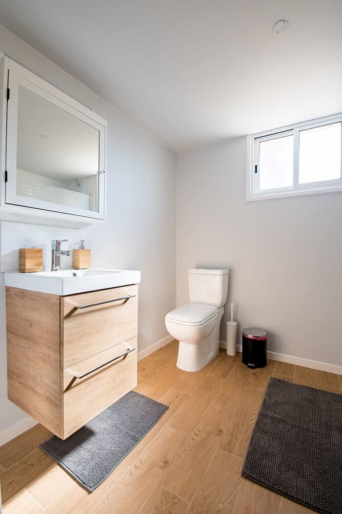 clean toilet and vanity in white bathroom